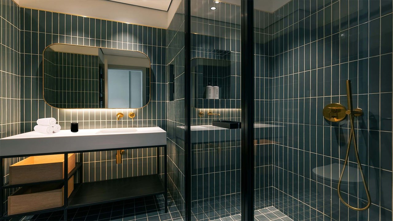 Luxurious bathroom in the rental studio at Upside Living, featuring high-quality materials and modern fixtures.