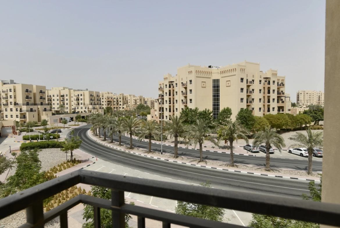 Street view from the balcony of a 2-bedroom apartment for sale in Al Rimth 13, Remraam, Dubai.