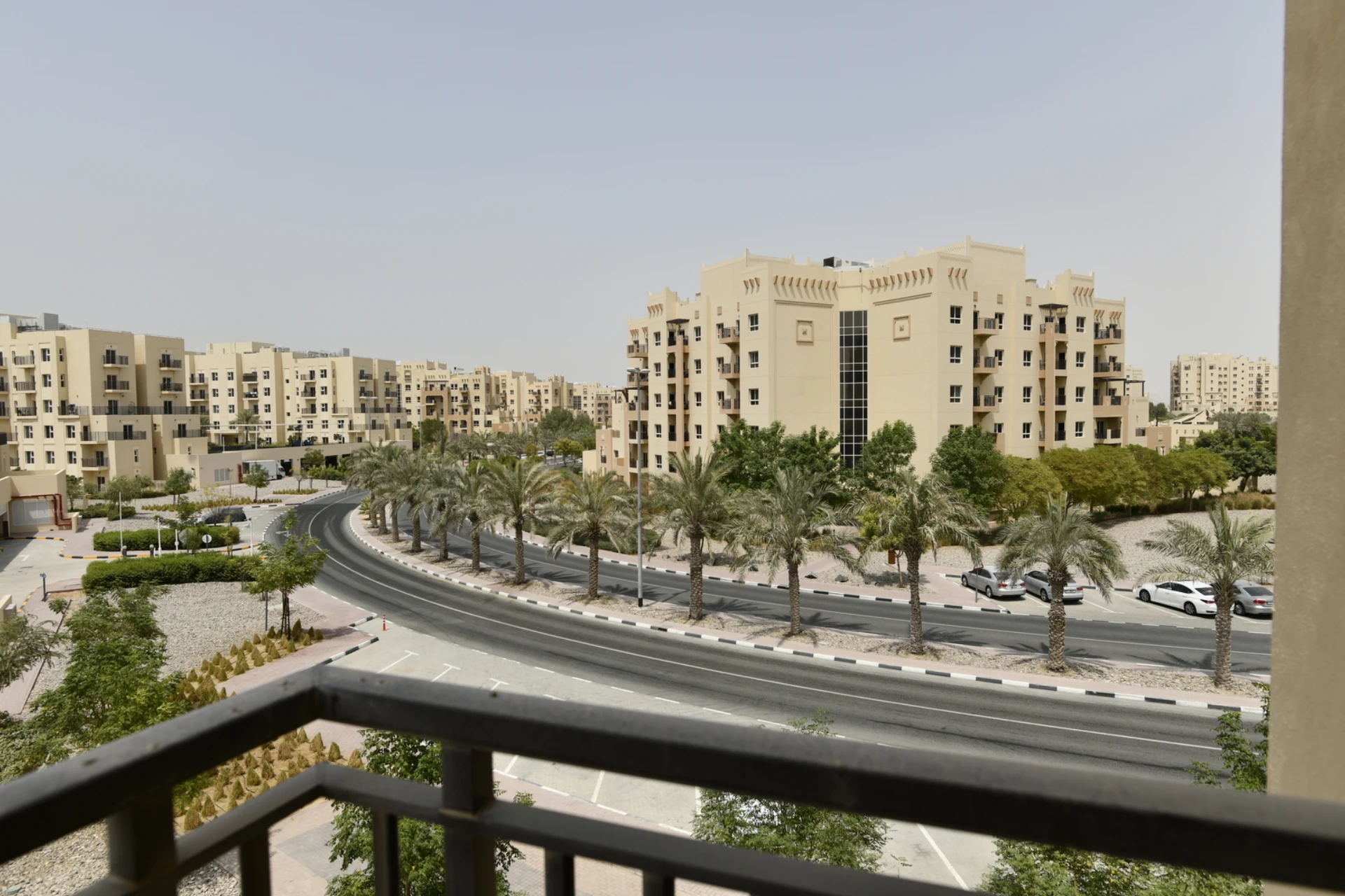 Street view from the balcony of a 2-bedroom apartment for sale in Al Rimth 13, Remraam, Dubai.