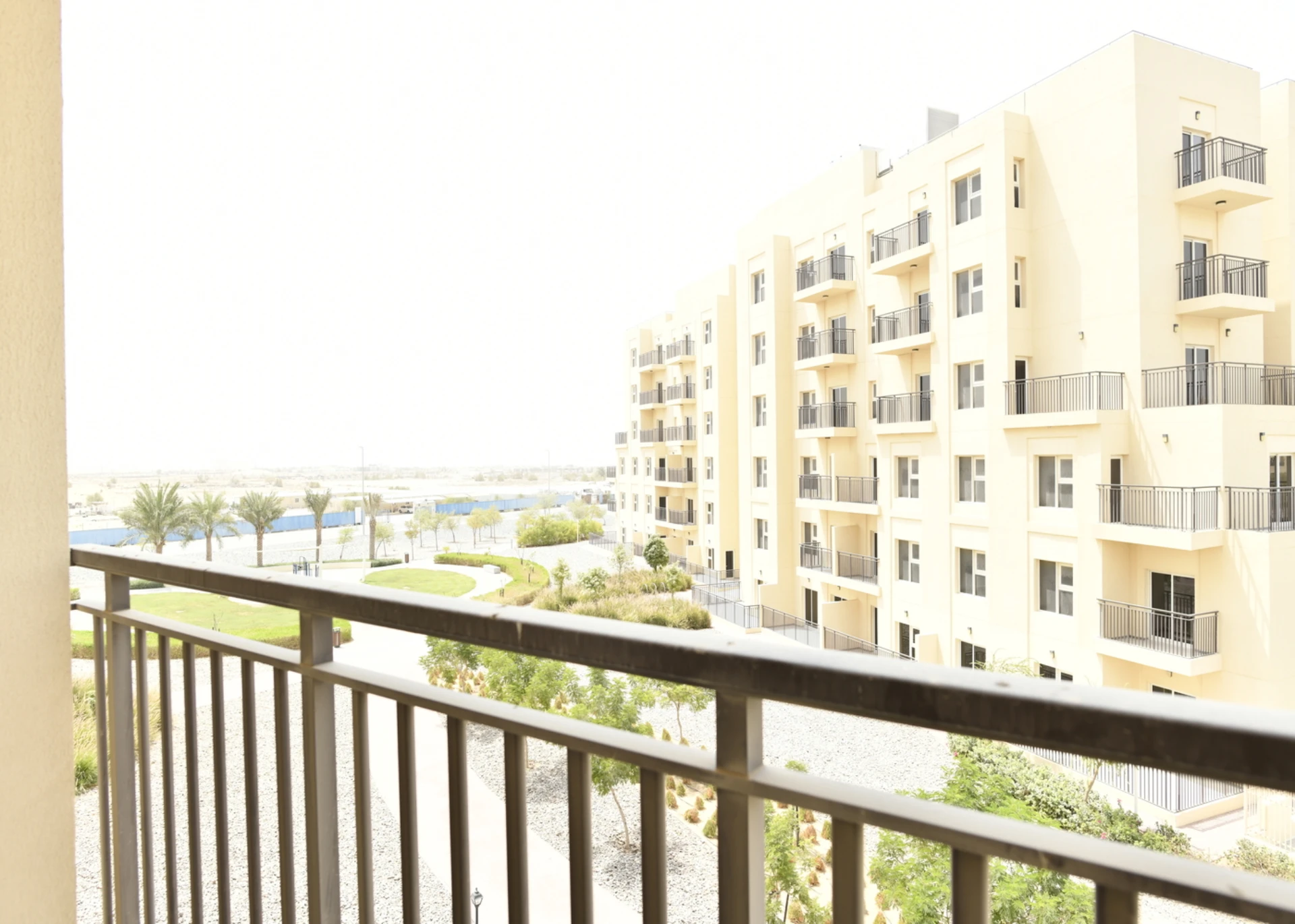 Street view from the balcony of a 2-bedroom apartment for sale in Al Rimth 13, Remraam, Dubai.