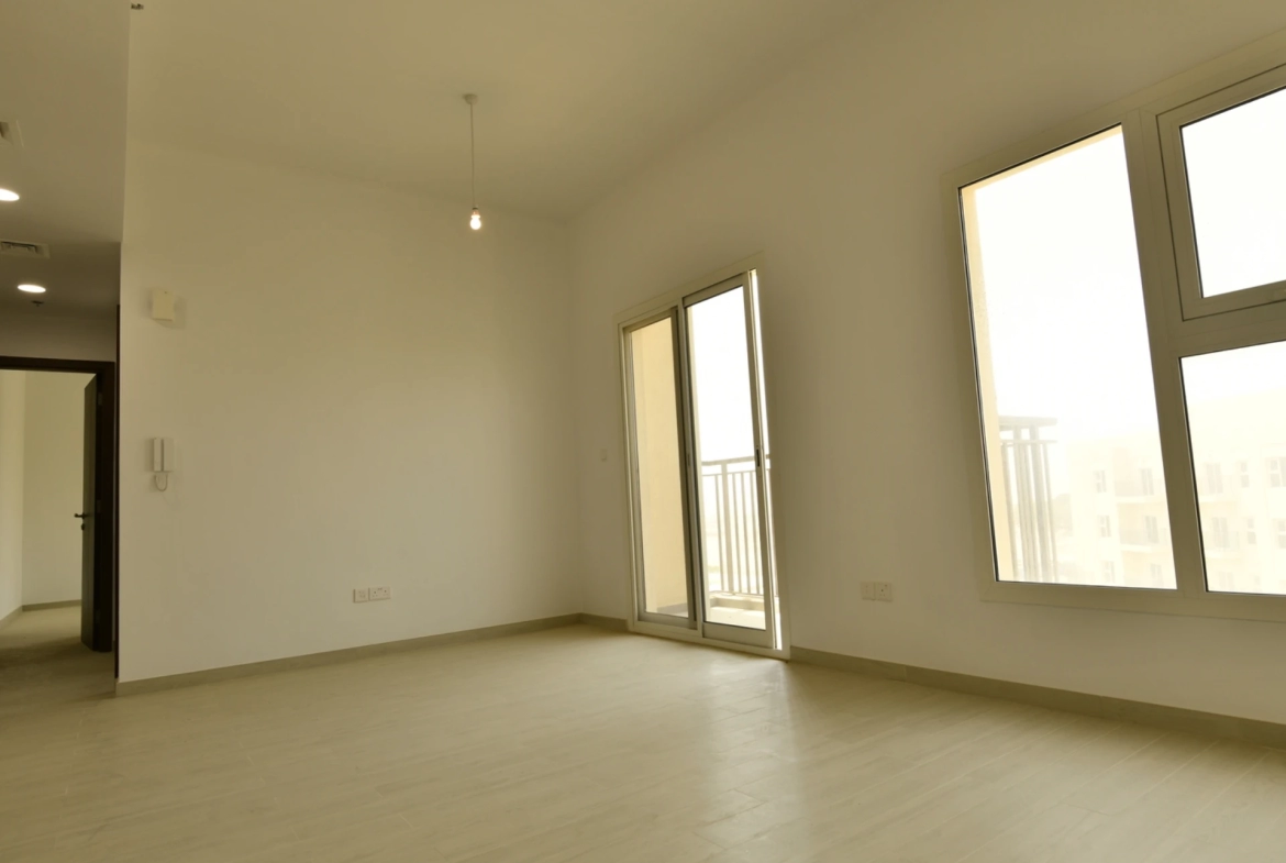 Another view of the living room in a 2-bedroom apartment for sale in Al Rimth 13, Remraam, Dubai