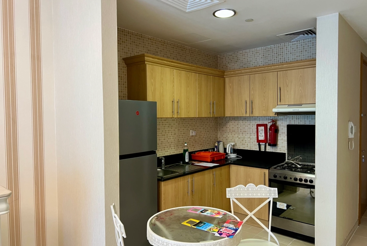 Furnished kitchen in a 1-bedroom apartment for rent in Mayfair Residency, Business Bay, Dubai