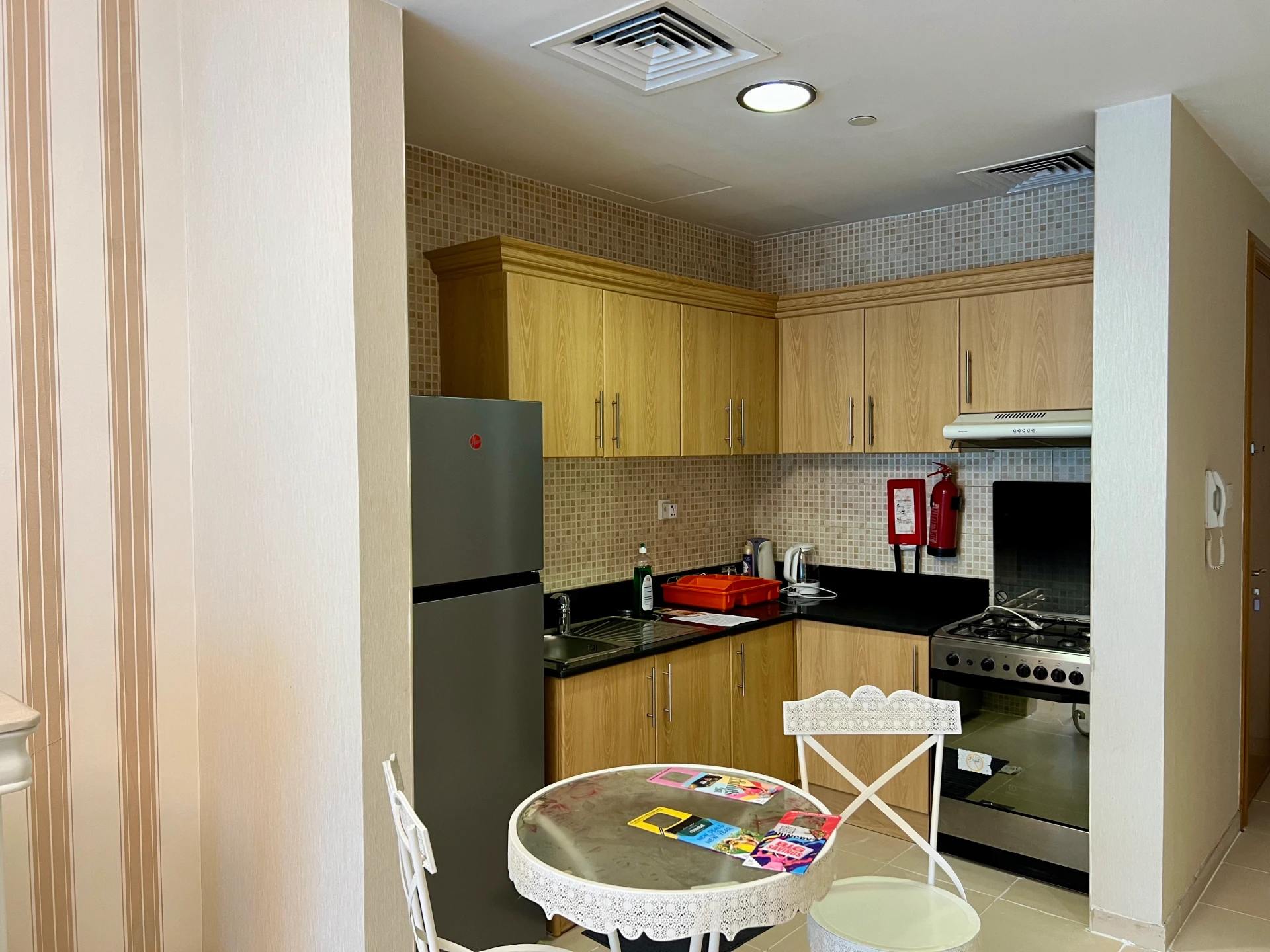 Furnished kitchen in a 1-bedroom apartment for rent in Mayfair Residency, Business Bay, Dubai