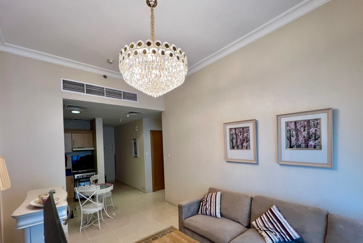 Furnished living room in a 1-bedroom apartment for rent in Mayfair Residency, Business Bay, Dubai.