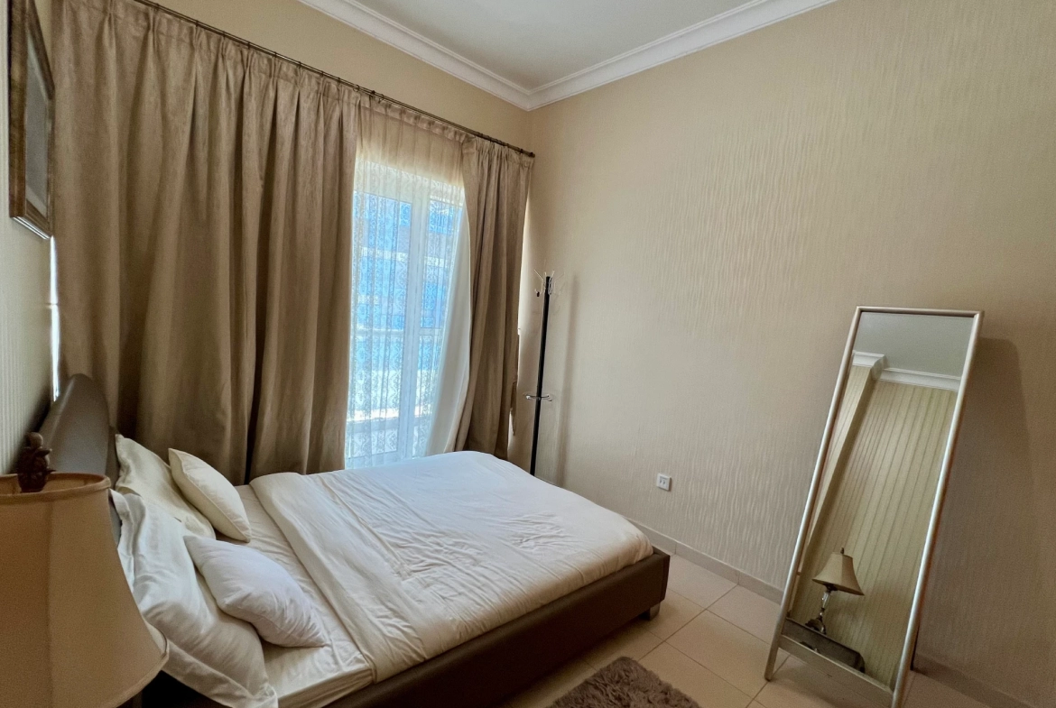 Furnished bedroom in a 1-bedroom apartment for rent in Mayfair Residency, Business Bay, Dubai.