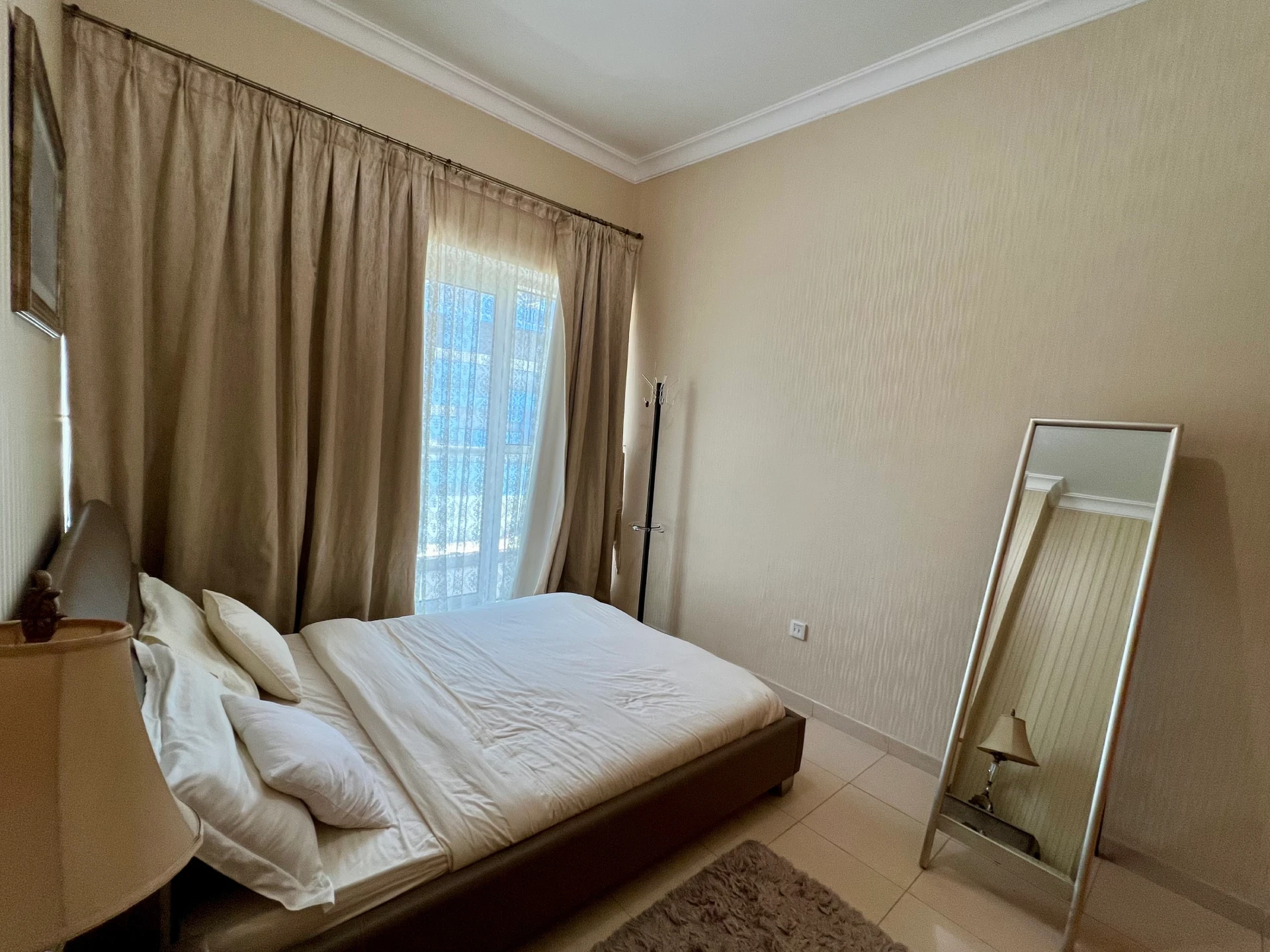 Furnished bedroom in a 1-bedroom apartment for rent in Mayfair Residency, Business Bay, Dubai.