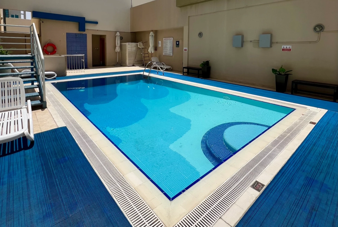 Swimming pool available for residents of a furnished 1-bedroom apartment for rent in Mayfair Residency, Business Bay, Dubai.