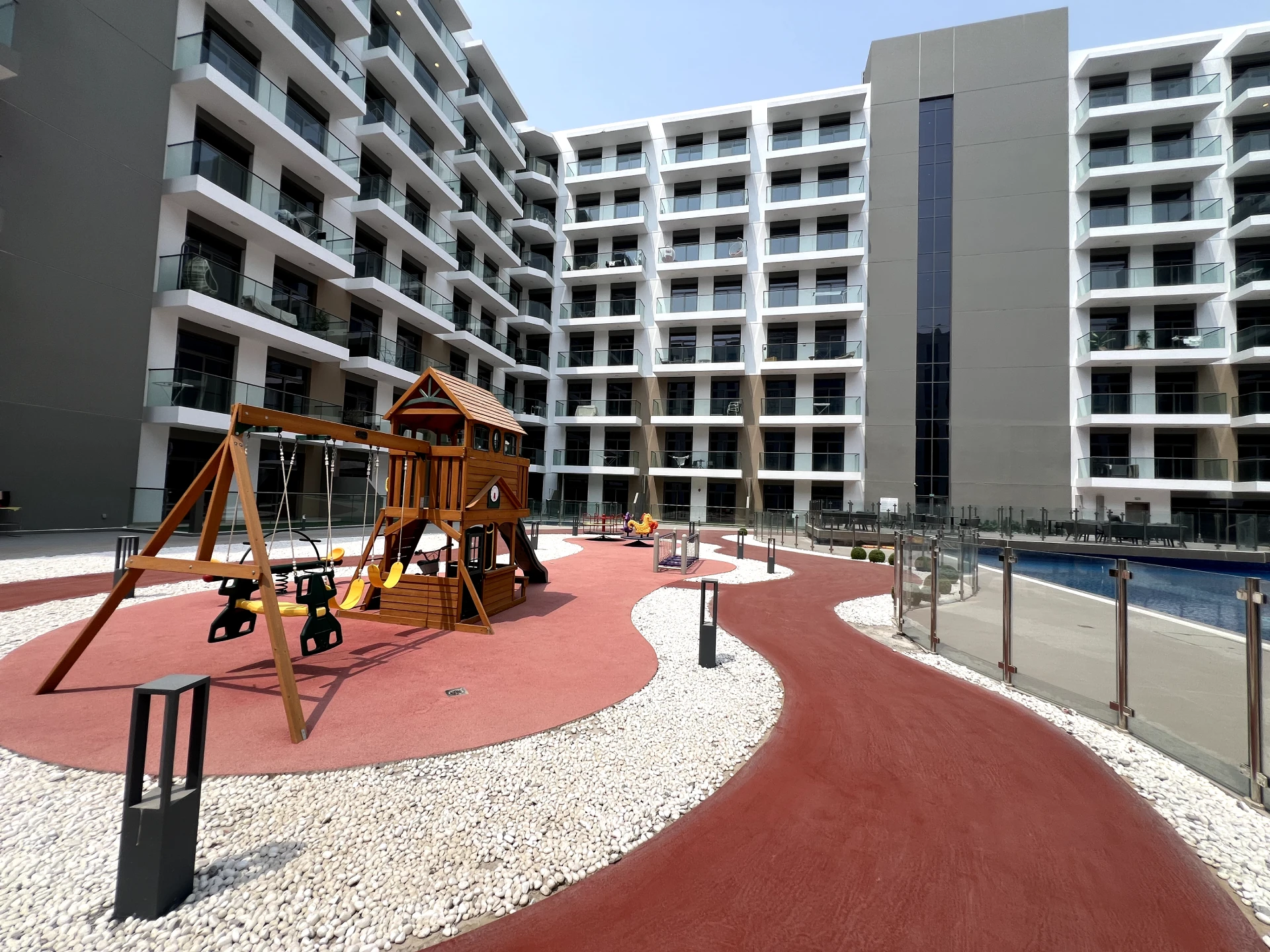 Playground area in Laya Heights, Studio City, Dubai, available for residents