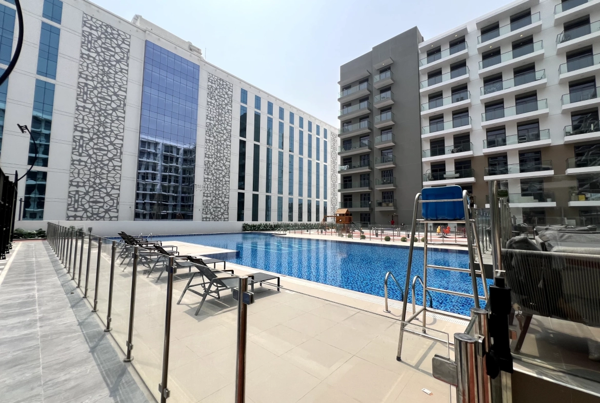 Swimming pool in Laya Heights, Studio City, Dubai, available for residents.