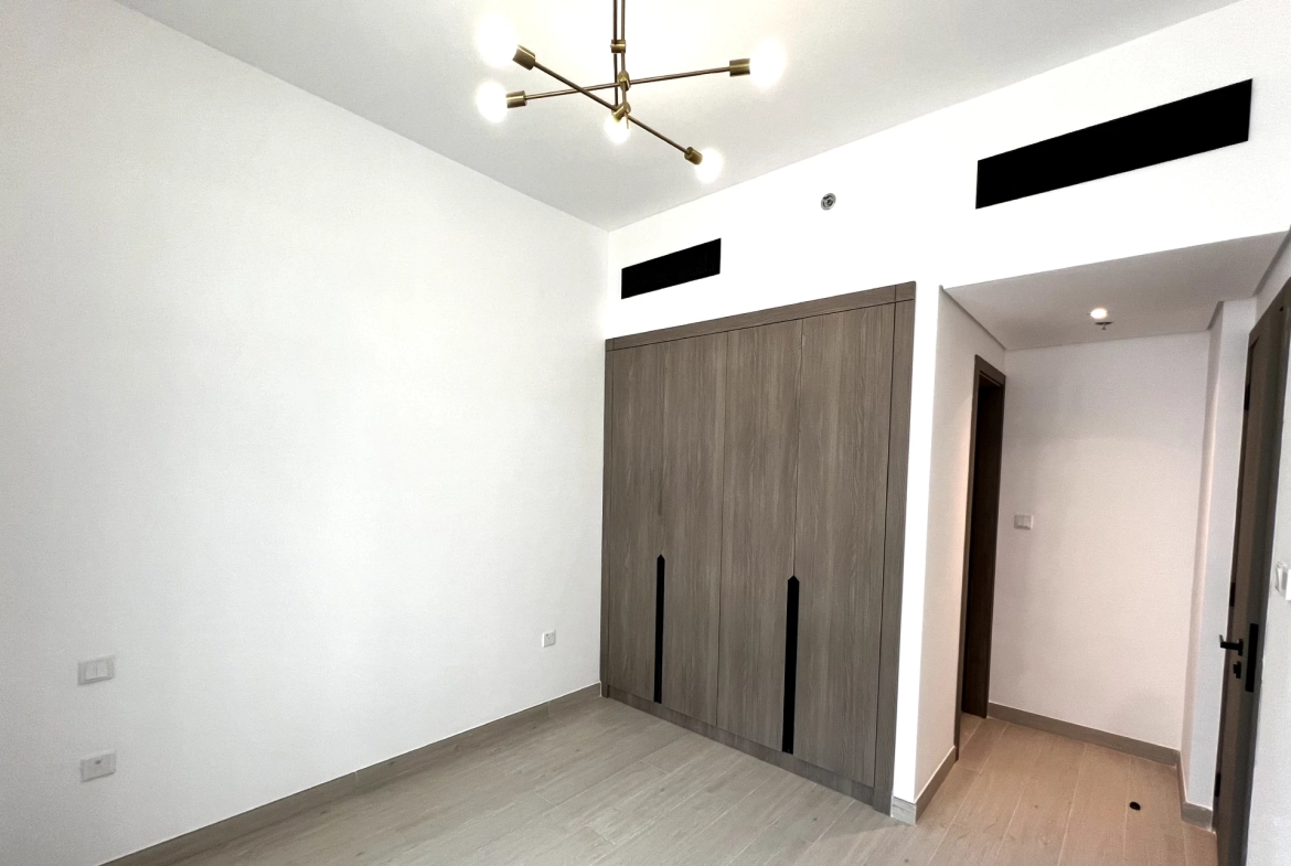 Bedroom in a 1-bedroom apartment for rent in Laya Heights, Studio City, Dubai.