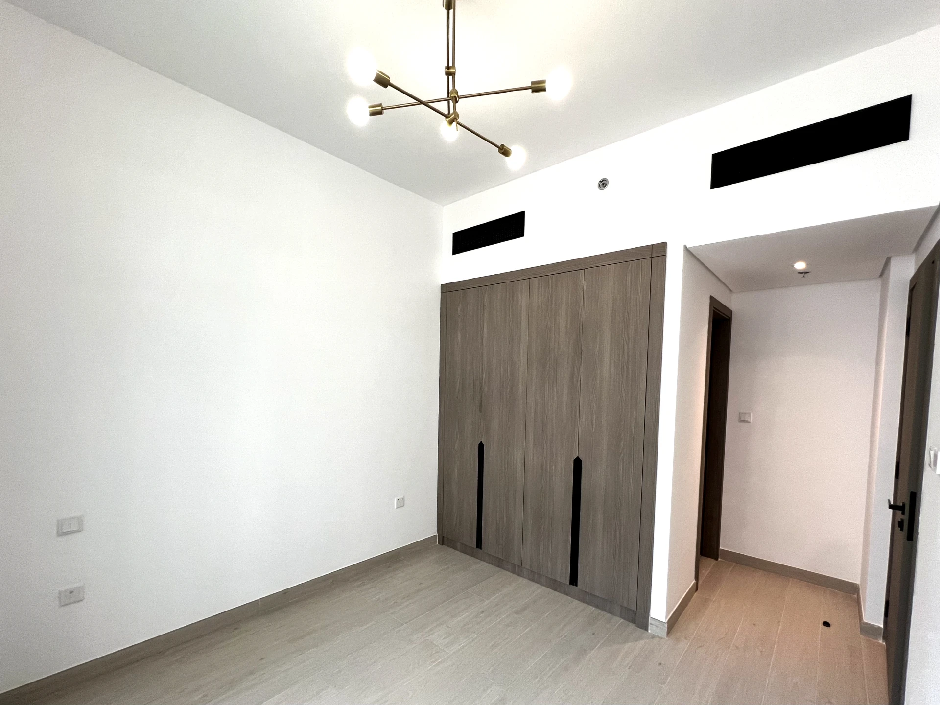 Bedroom in a 1-bedroom apartment for rent in Laya Heights, Studio City, Dubai.